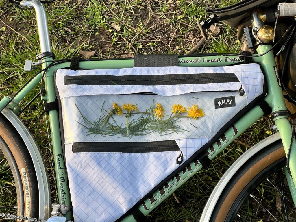 Handmade bikepacking frame bag attached to a bicycle, created with affordable materials