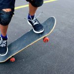 Skater performing ollie on LOSENKA Maple Deck in urban street setting
