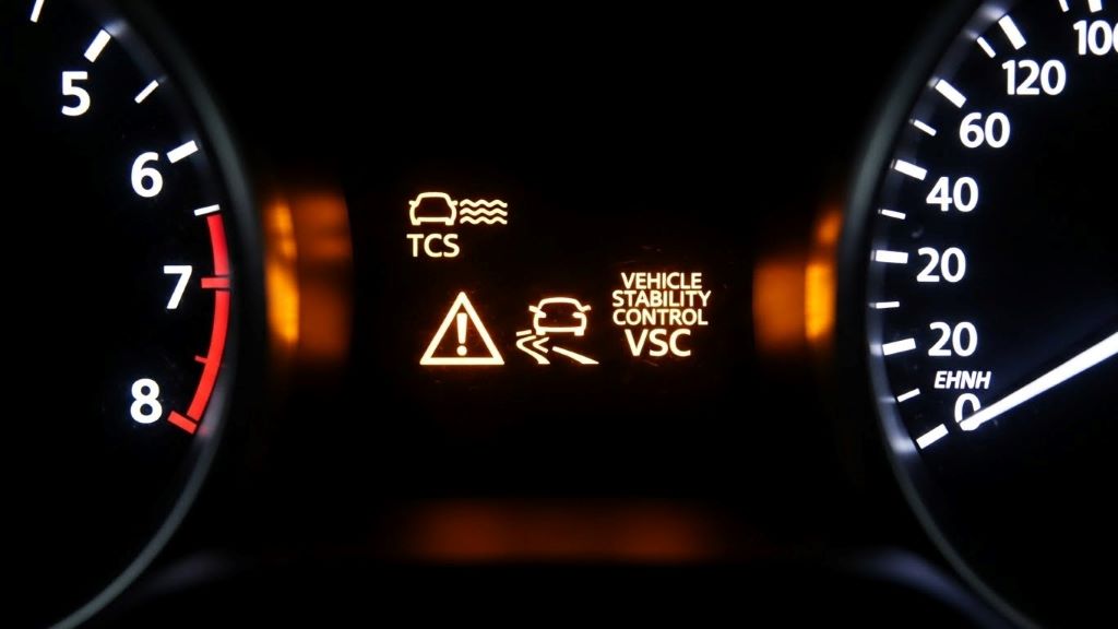 Dashboard warning light showing traction control and vehicle stability control system indicators illuminated
